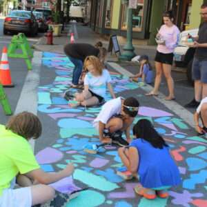 kids make public art - a chalk mural - for their afterschool program at The Arts Center