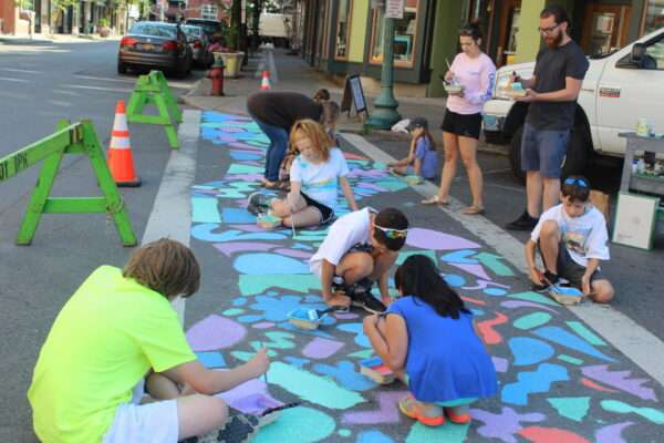 kids make public art - a chalk mural - for their afterschool program at The Arts Center